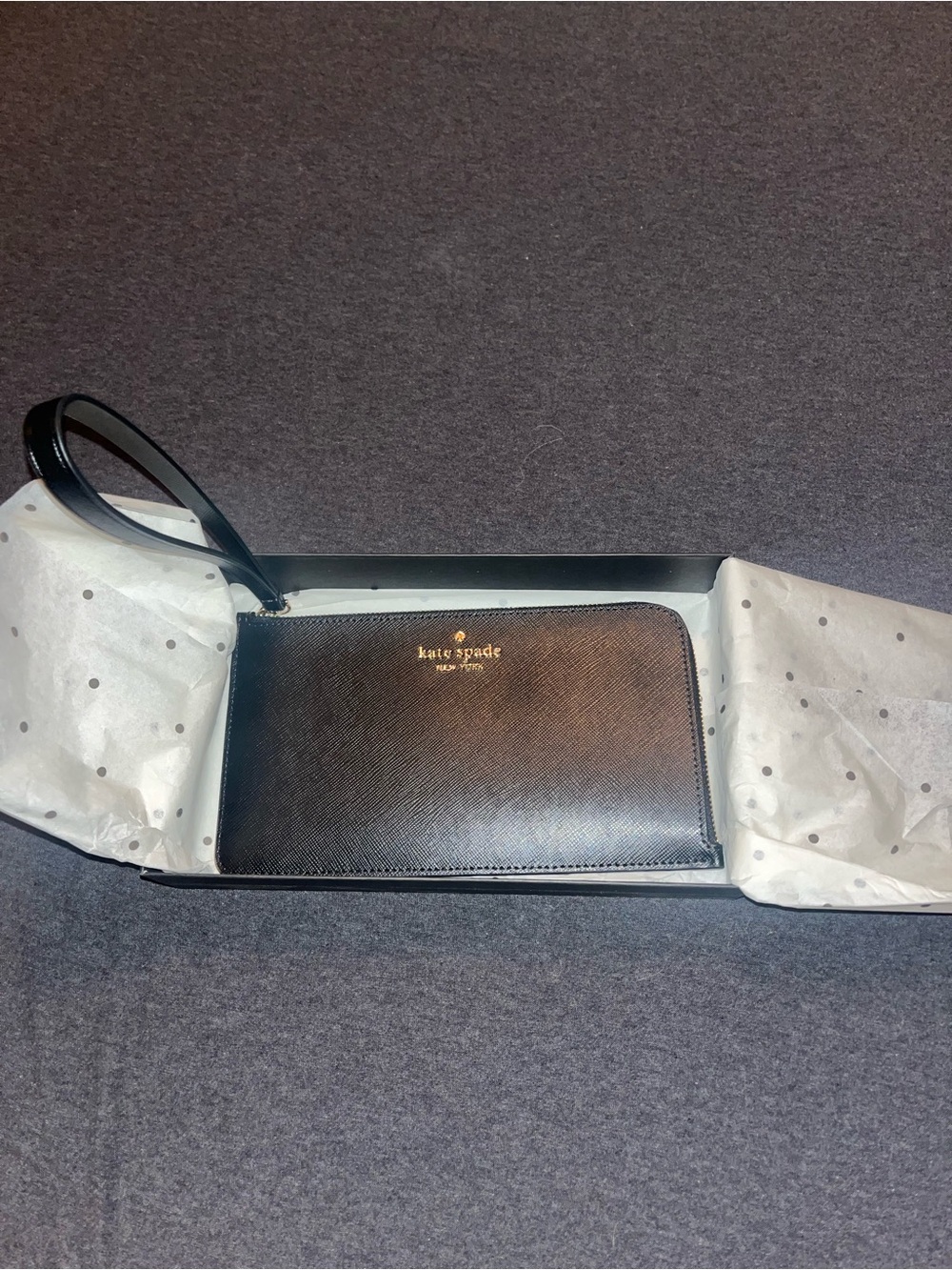kate spade black leather zip wristlet with gold logo